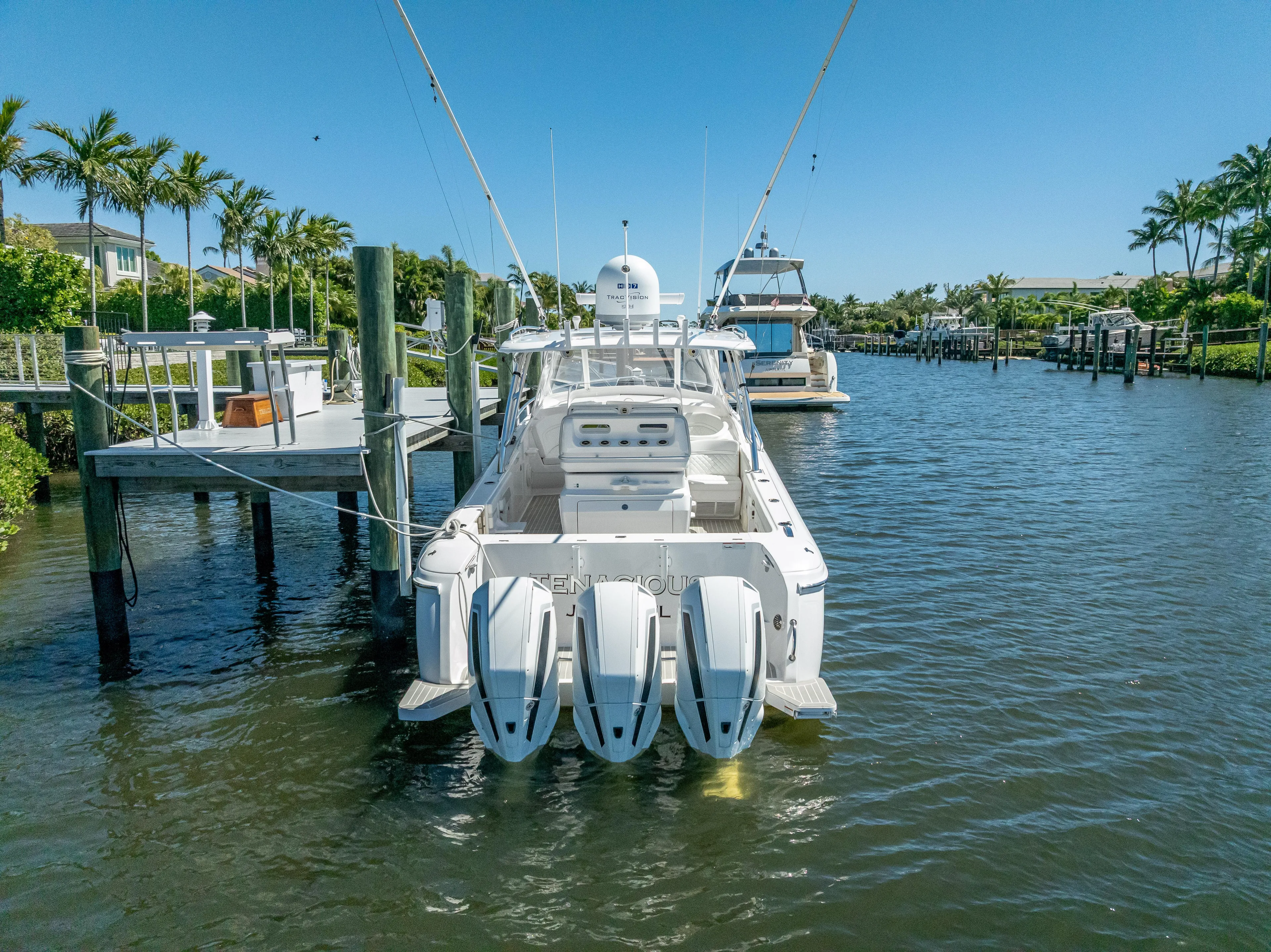  Yacht Photos Pics 2020 Intrepid 407 Cuddy boat docked in a scenic marina.
