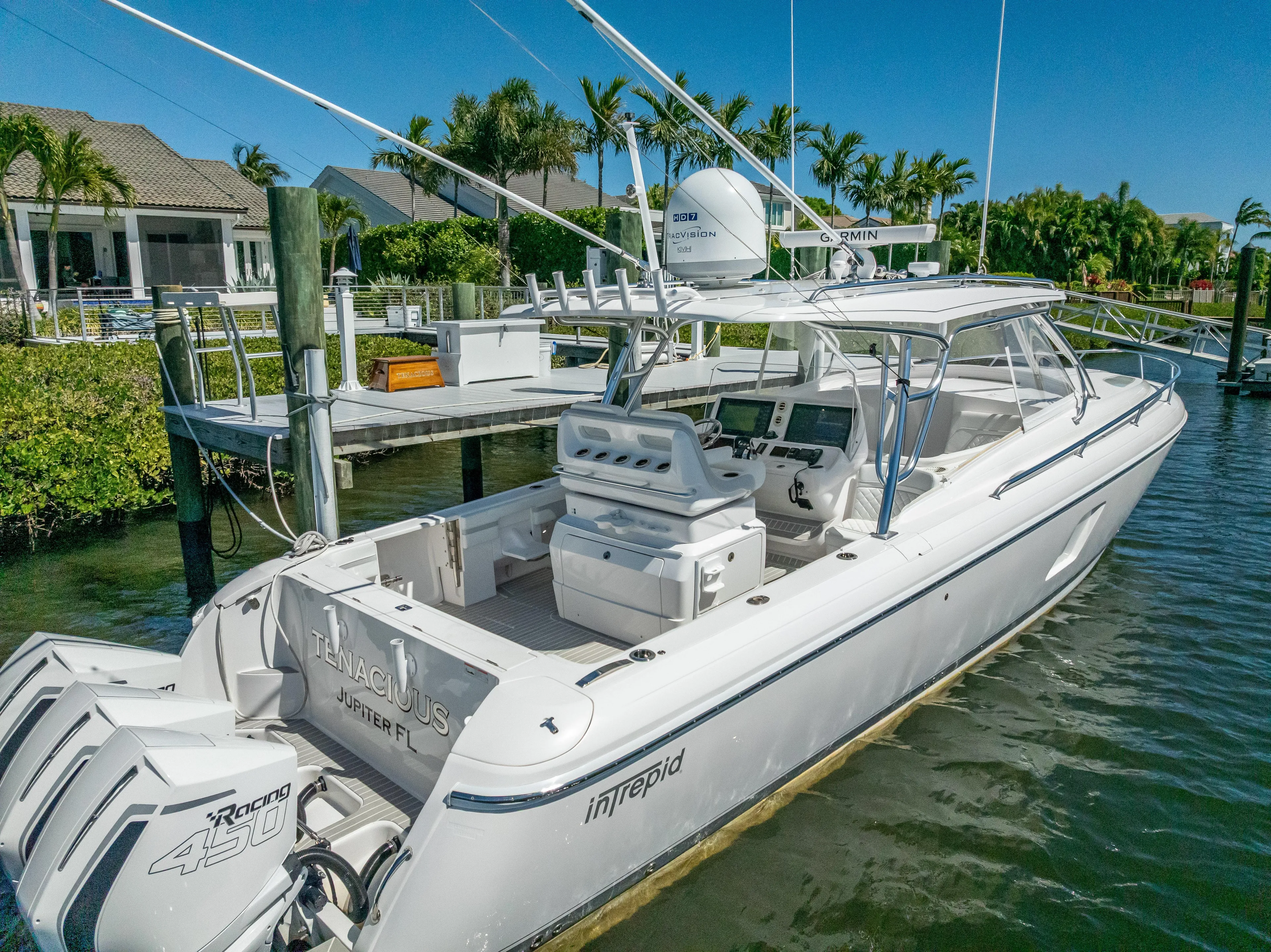  Yacht Photos Pics 2020 Intrepid 407 Cuddy boat docked in a scenic marina setting.