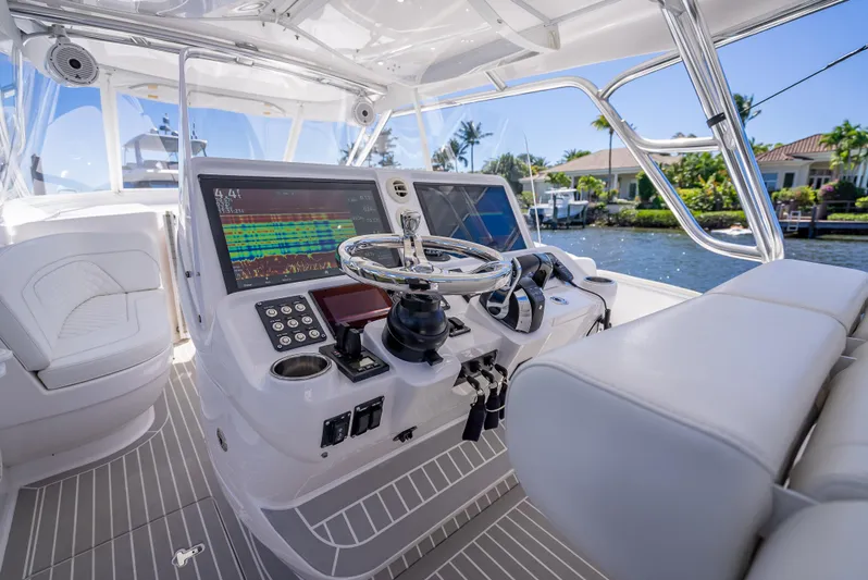  Yacht Photos Pics 2020 Intrepid 407 Cuddy boat helm with advanced navigation systems and luxurious seating.