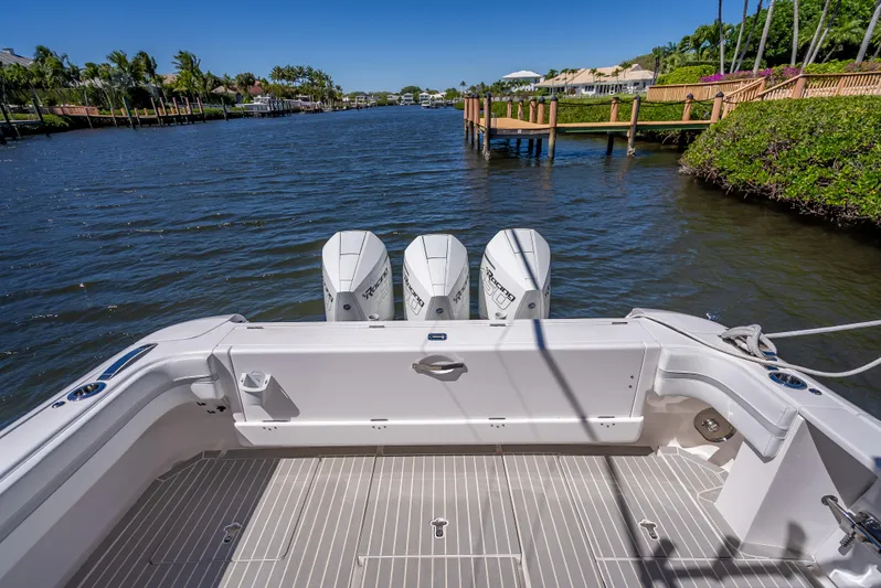  Yacht Photos Pics 2020 Intrepid 407 Cuddy boat with triple engines on a scenic waterway.