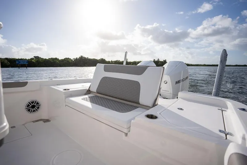  Yacht Photos Pics 2025 Caymas 291 HB boat interior with seating, on a sunny day by the water.