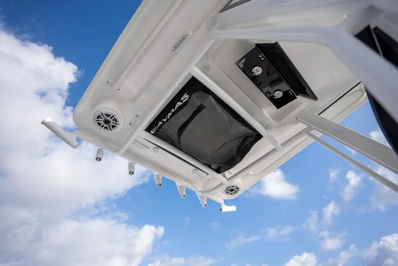  Yacht Photos Pics 2025 Caymas 291 HB boat roof with speakers and storage against blue sky.