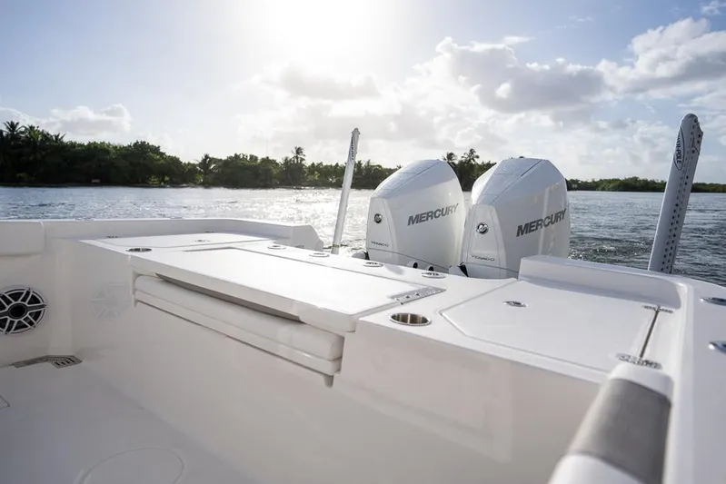  Yacht Photos Pics 2025 Caymas 291 HB boat with dual Mercury engines on a sunny day.