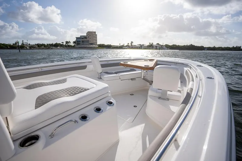  Yacht Photos Pics 2025 Caymas 291 HB boat on calm water, featuring spacious seating and elegant design.