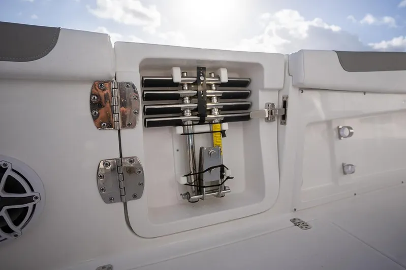  Yacht Photos Pics 2025 Caymas 291 HB boat compartment with mechanical components and hinges, under a bright sky.