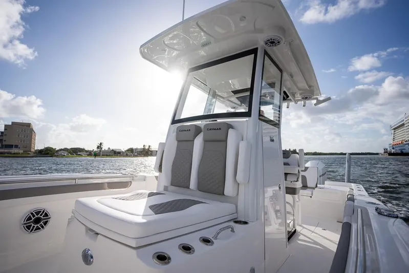  Yacht Photos Pics 2025 Caymas 291 HB boat on water, featuring sleek design and modern seating.