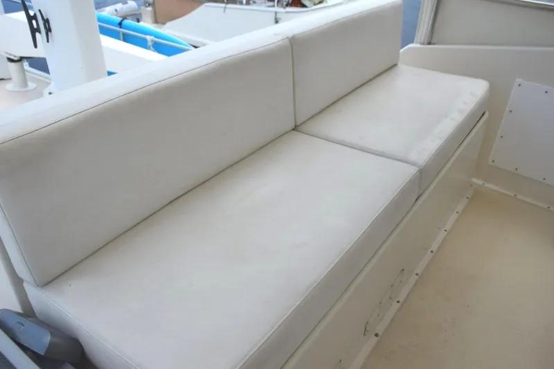 Qa3 Yacht Photos Pics Helm Deck aft companion bench seat with white vinyl cushions