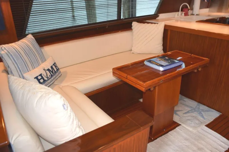 Qa3 Yacht Photos Pics Settee with freshly recovered cushions and expandable Hi-Lo table
