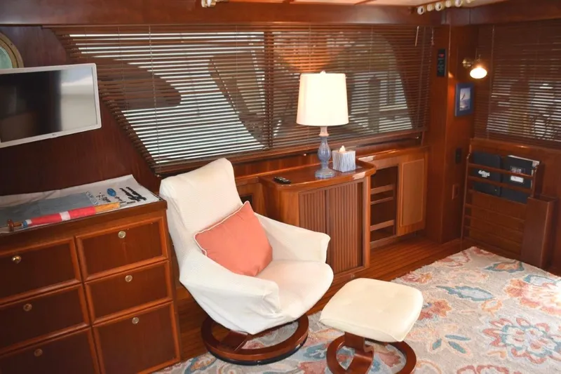 Qa3 Yacht Photos Pics Lounge chair with ottoman between desk area and AV cabinet