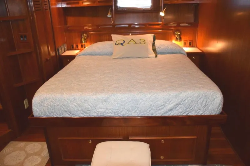 Qa3 Yacht Photos Pics Comfortable berth with reading light and drawer storage beneath and in nightstand to either side of the bed