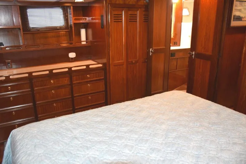 Qa3 Yacht Photos Pics Portlights to either side of the stateroom and note abundance of drawers in dresser next to cedar lined hanging closet and head entry door