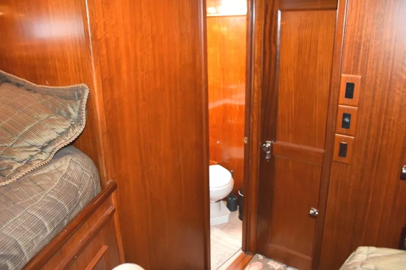 Qa3 Yacht Photos Pics Guest stateroom private entry door to Guest head, stateroom door closed.