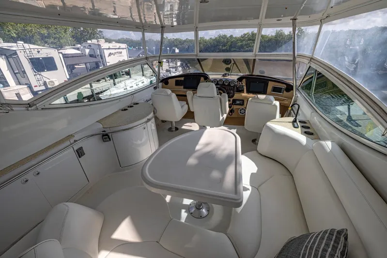 Paradise Yacht Photos Pics Luxurious interior of 2002 Carver 466 Motor Yacht with plush seating and modern dashboard.