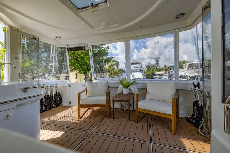 Paradise Yacht Photos Pics Luxurious interior of 2002 Carver 466 Motor Yacht with seating and scenic marina view.