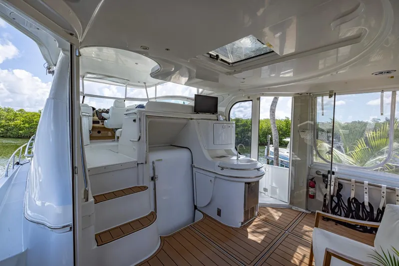 Paradise Yacht Photos Pics 2002 Carver 466 Motor Yacht interior with modern design, featuring seating and helm station.