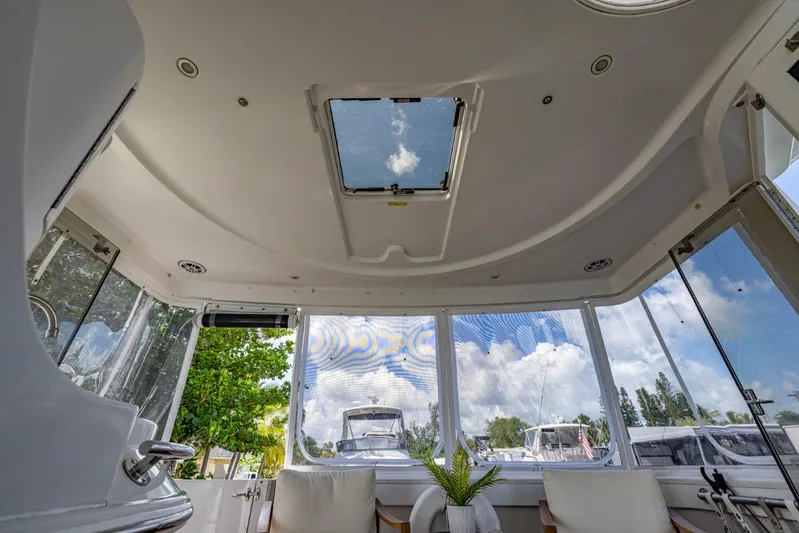 Paradise Yacht Photos Pics Interior view of 2002 Carver 466 Motor Yacht with skylight and seating area.