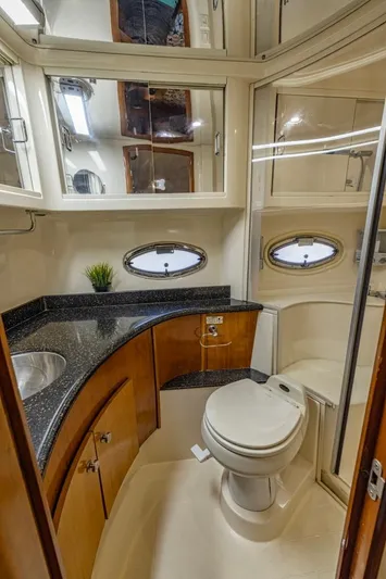 Paradise Yacht Photos Pics Luxurious bathroom in 2002 Carver 466 Motor Yacht with modern fixtures and elegant design.