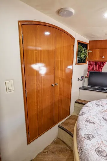 Paradise Yacht Photos Pics Interior of 2002 Carver 466 Motor Yacht with wooden cabinetry and cozy seating area.