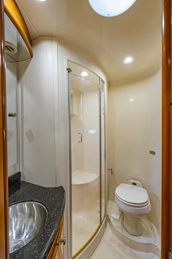 Paradise Yacht Photos Pics Luxurious bathroom in 2002 Carver 466 Motor Yacht with shower, sink, and toilet.