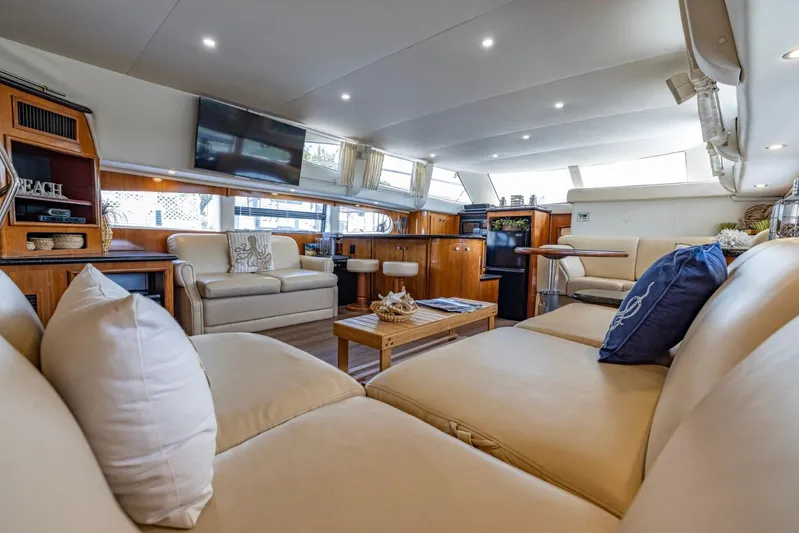 Paradise Yacht Photos Pics Luxurious interior of 2002 Carver 466 Motor Yacht with plush seating and modern amenities.