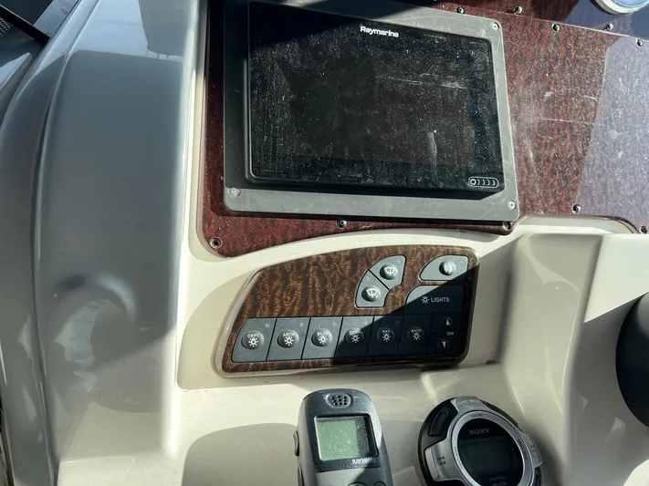 Vitamin Sea Yacht Photos Pics Control panel of a 2010 Sea Ray 330 Sundancer boat with navigation equipment.