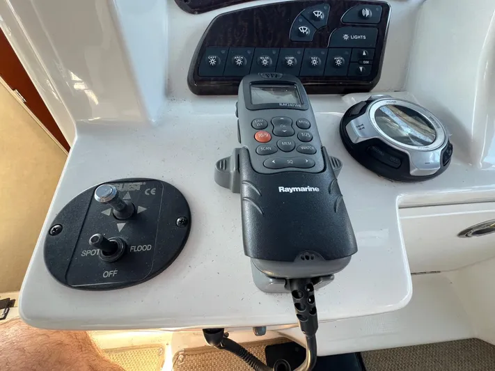 Vitamin Sea Yacht Photos Pics Control panel of a 2010 Sea Ray 330 Sundancer with Raymarine device and switches.