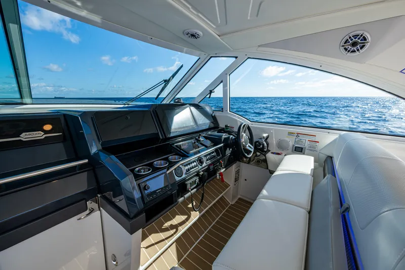  Yacht Photos Pics 2022 Formula 380 Super Sport Crossover OB interior with ocean view, featuring modern helm and seating.