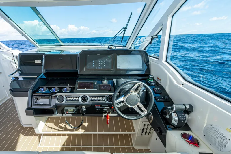  Yacht Photos Pics 2022 Formula 380 Super Sport Crossover OB helm with advanced navigation system, ocean view.