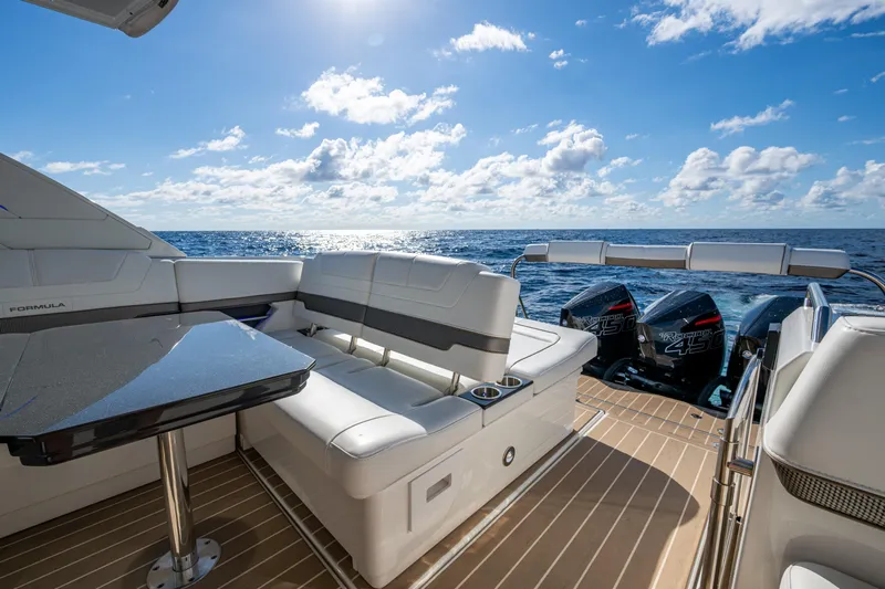  Yacht Photos Pics 2022 Formula 380 Super Sport Crossover OB on open sea, featuring luxurious seating and powerful engines.