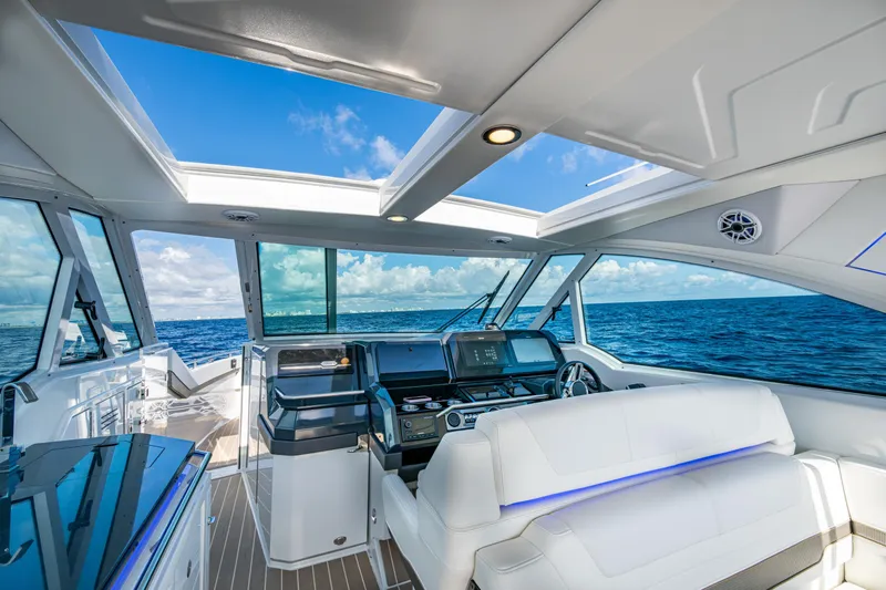  Yacht Photos Pics 2022 Formula 380 Super Sport Crossover OB interior with ocean view, featuring modern helm and seating.