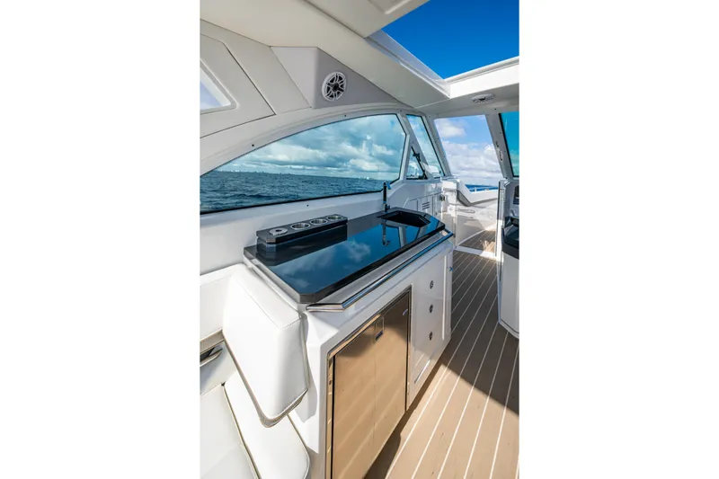  Yacht Photos Pics Interior of 2022 Formula 380 Super Sport Crossover OB, featuring sleek kitchen and ocean view.