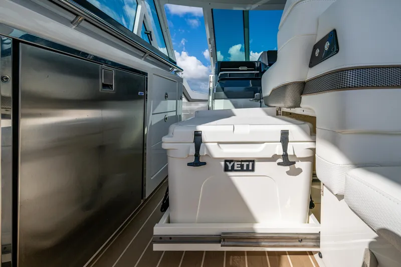  Yacht Photos Pics 2022 Formula 380 Super Sport Crossover OB interior with Yeti cooler and stainless steel features.