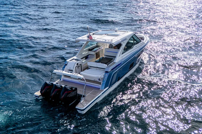  Yacht Photos Pics 2022 Formula 380 Super Sport Crossover OB cruising on sparkling blue water.