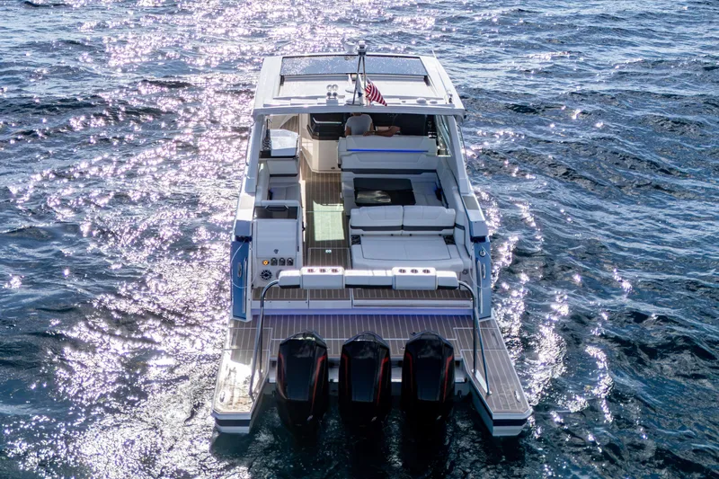  Yacht Photos Pics 2022 Formula 380 Super Sport Crossover OB cruising on sparkling blue water.