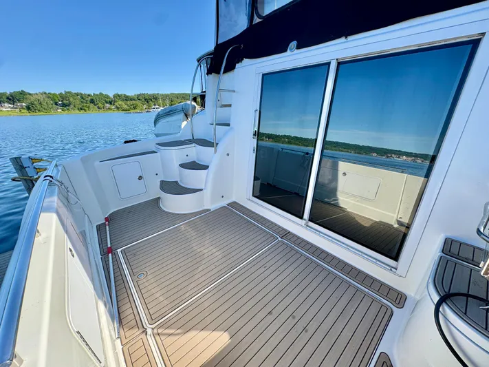  Yacht Photos Pics 2005 Meridian 459 CMY yacht deck with sliding glass doors and scenic water view.