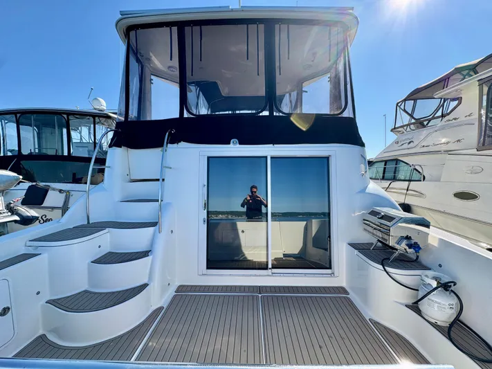  Yacht Photos Pics 2005 Meridian 459 CMY yacht with spacious deck and sliding glass doors.