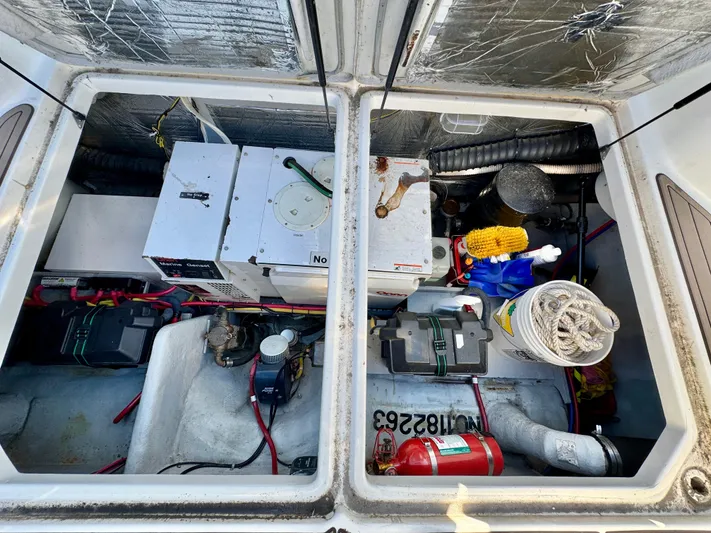  Yacht Photos Pics Engine compartment of 2005 Meridian 459 CMY with equipment and storage items visible.