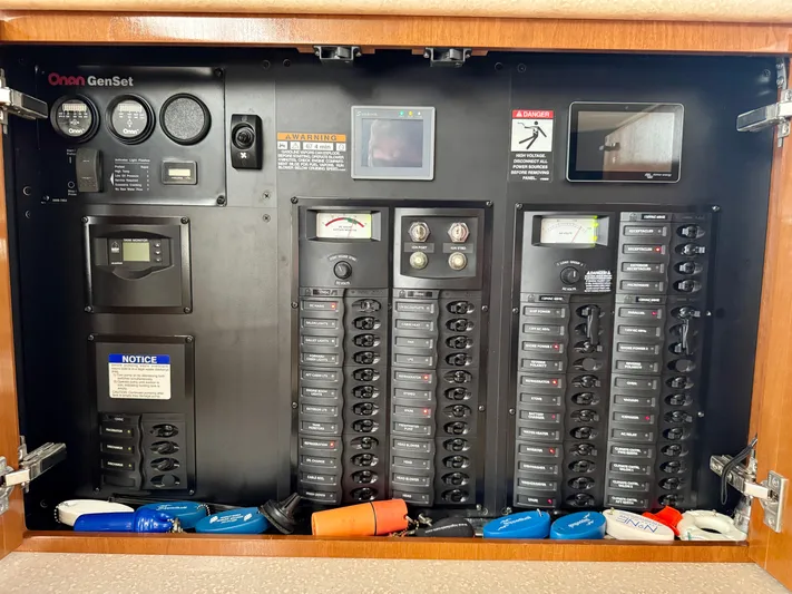  Yacht Photos Pics Electrical control panel of a 2005 Meridian 459 CMY boat with various switches and gauges.