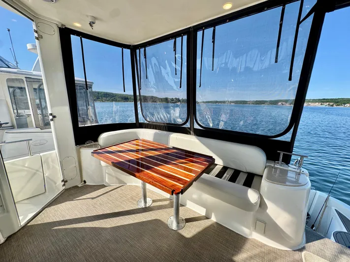  Yacht Photos Pics Luxurious 2005 Meridian 459 CMY yacht interior with elegant seating and scenic water views.