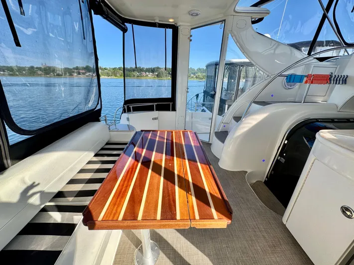 Yacht Photos Pics Luxurious 2005 Meridian 459 CMY yacht interior with wooden table and scenic water view.