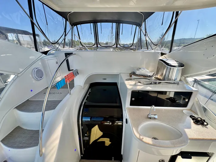  Yacht Photos Pics Interior of 2005 Meridian 459 CMY yacht with kitchenette and stairs.