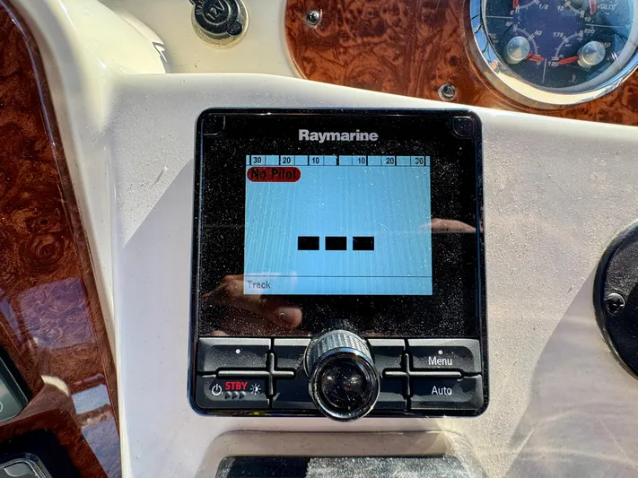  Yacht Photos Pics Raymarine navigation system on 2005 Meridian 459 CMY boat dashboard.