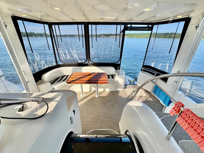  Yacht Photos Pics Luxurious 2005 Meridian 459 CMY yacht interior with panoramic lake views and elegant seating area.