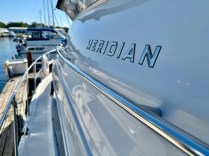  Yacht Photos Pics 2005 Meridian 459 CMY yacht docked at marina, close-up of logo.