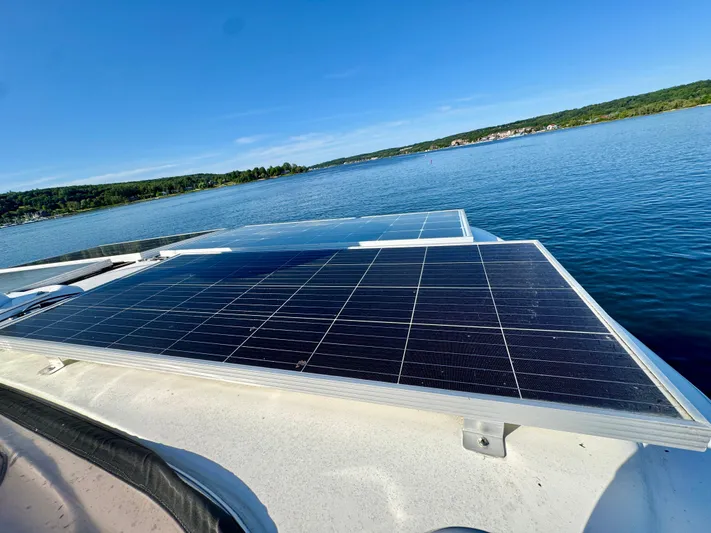  Yacht Photos Pics Solar panels on a 2005 Meridian 459 CMY yacht, overlooking a serene lake.