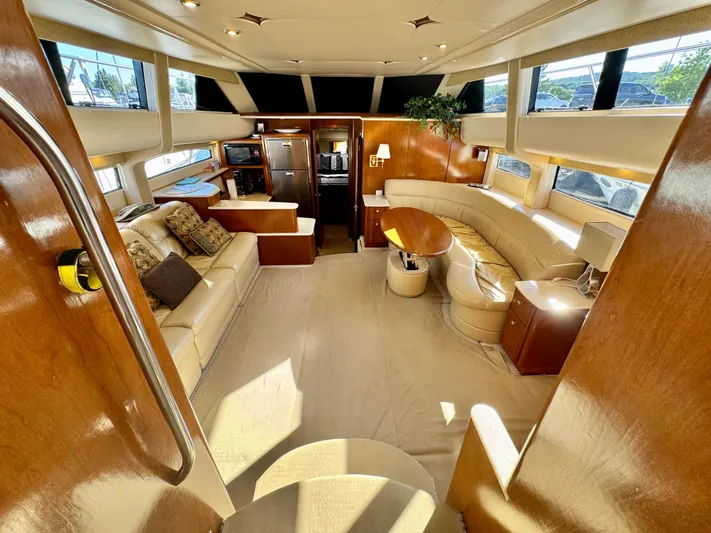  Yacht Photos Pics Luxurious interior of 2005 Meridian 459 CMY yacht with elegant seating and modern amenities.