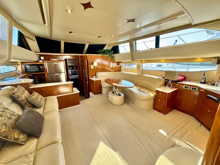  Yacht Photos Pics Luxurious interior of a 2005 Meridian 459 CMY yacht with elegant seating and modern amenities.