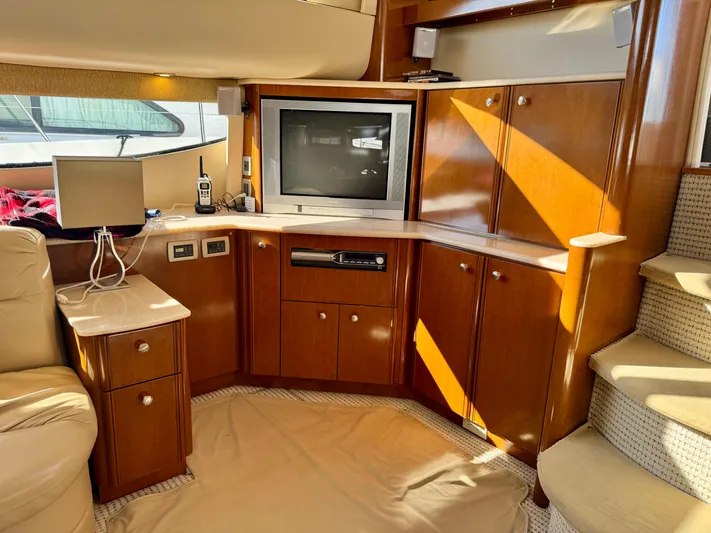  Yacht Photos Pics Interior of 2005 Meridian 459 CMY yacht with TV, cabinets, and stairs.