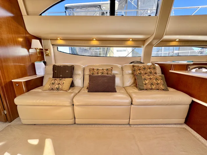  Yacht Photos Pics Luxurious interior of 2005 Meridian 459 CMY yacht with plush leather seating and decorative cushions.
