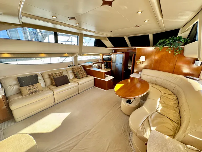  Yacht Photos Pics Luxurious interior of 2005 Meridian 459 CMY yacht with plush seating and elegant decor.
